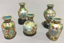 A collection of small cloisonne vases