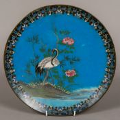 A cloisonne plate decorated with a stork