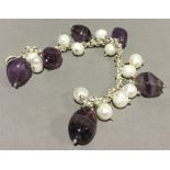 A silver and amethyst bracelet