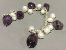 A silver and amethyst bracelet