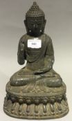 A bronze model of a Buddha