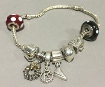 A silver Pandora charm bracelet, etc.