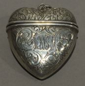 A silver vesta in the form of a heart