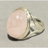 A silver and rose quartz ring