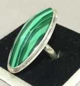 A silver and malachite ring