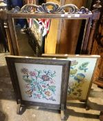 A Victorian rosewood fire screen frame and two embroidered fire screens