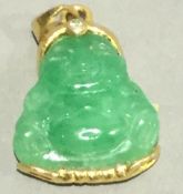 A carved jade Buddha pendant