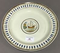 A Creamware plate decorated with a galleon in full sail