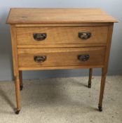 A two drawer oak side table