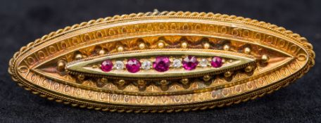 A gold brooch set with rubies and diamond