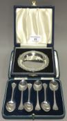A cased silver pin tray and boxed spoons