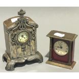 An Art Nouveau mantel clock and another