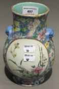 A small Chinese porcelain vase decorated with flowers