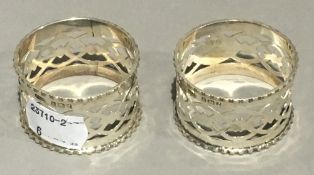 A pair of silver napkin rings,