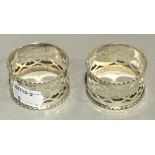 A pair of silver napkin rings,