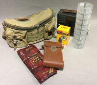 A quantity of miscellaneous fishing items, cameras, etc.