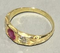 An 18 ct gold diamond and ruby ring