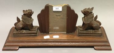 An Eastern carved hardwood picture frame