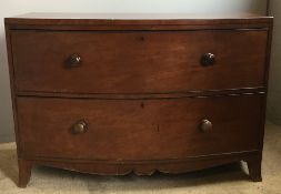 A Georgian mahogany bow front chest of drawers