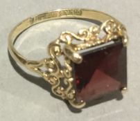 A 9 ct gold and garnet ring