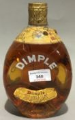 A bottle of Haigh Dimple Whisky