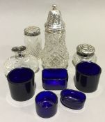 A collection of silver mounted bottles and glass liners