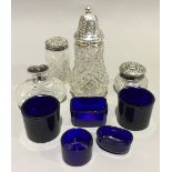 A collection of silver mounted bottles and glass liners