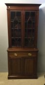 A Victorian walnut bookcase cabinet