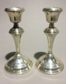 A pair of silver candlesticks