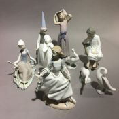 A collection of Lladro figures,