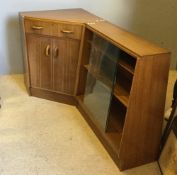 A mid century G-Plan corner secretaire together with a glazed bookcase section en-suite