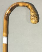 A late 19th/early 20th century bamboo walking stick carved with monkeys