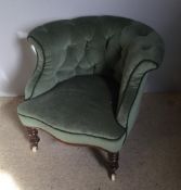 A Victorian mahogany framed green upholstered button back tub armchair