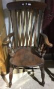 A 19th century farmhouse splat back wooden armchair