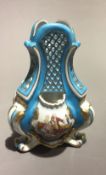 A blue pierced Sevres style vase