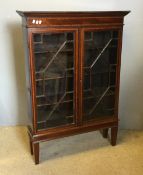 An Edwardian glazed bookcase