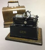 An Eddison Gem phonograph (lacking horn)