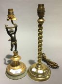 A brass table lamp and a bronze cherub form table lamp