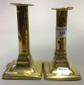 A pair of 19th century brass candlesticks