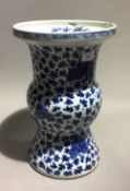 An 18th/19th century Chinese blue and white Gu vase