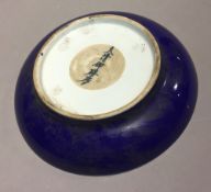 A Chinese shallow dish with blue outer glaze