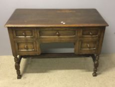 An early 20th century oak dressing table and mirror