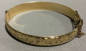 An engraved hinged bracelet