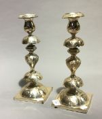 A pair of Polish silver plated candlesticks