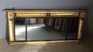 An early 19th century gilt framed triple plate over mantle