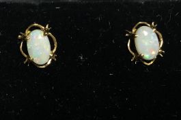 A pair of 9 ct gold and opal earrings