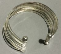 A silver segmented cuff bracelet