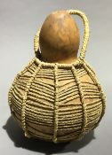 A beadwork club and a gourd