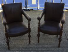 A pair of Victorian upholstered open armchairs