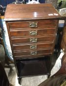 A Victorian walnut music cabinet